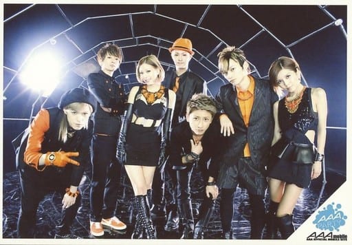 a Gathering 7 Persons Horizontal Knee Up Costume Black Orange Hat Neck Tilt Background Black Praty