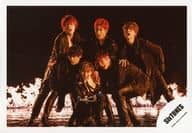 SixTONES / Gather (6 people) / Horizontal, Whole body, Costume black, Bent-forward, Left facing, Mouth open, Flame, Background black / Single "Imitation Rain / D. D." MV & Jacque-shot off-shot / Official Official photo